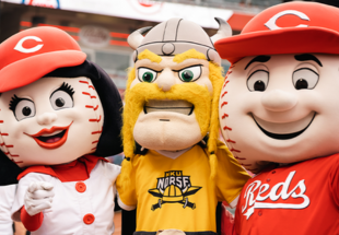 Rosie Red, Victor E. Viking, and Mr. Red posing for a photo in the Cincinnati Red's Great American Ball Park
