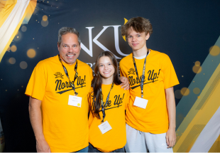 Image from Alumni Legacy day of father with children